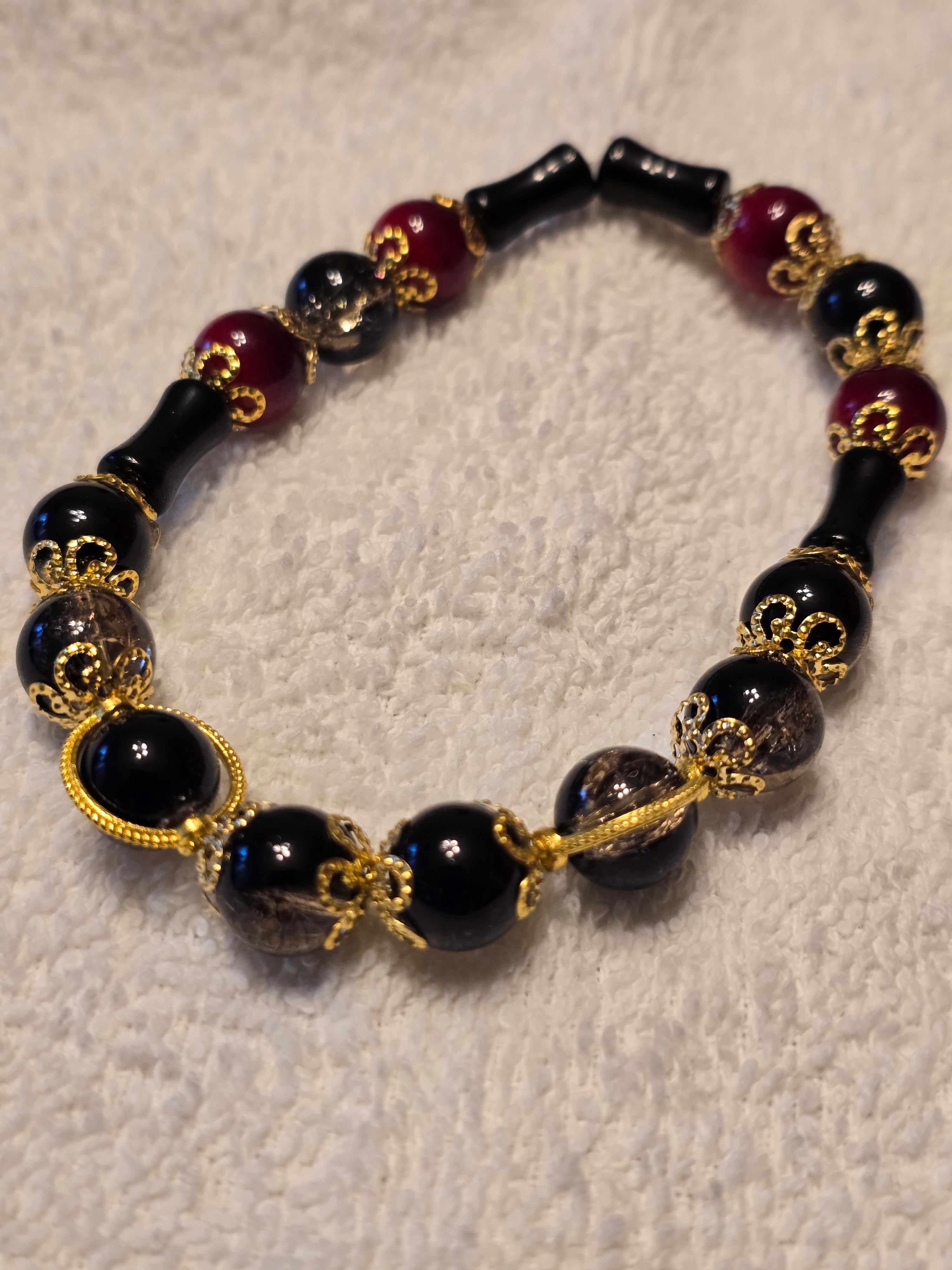Black and Red Glass Bead with Gold Accents