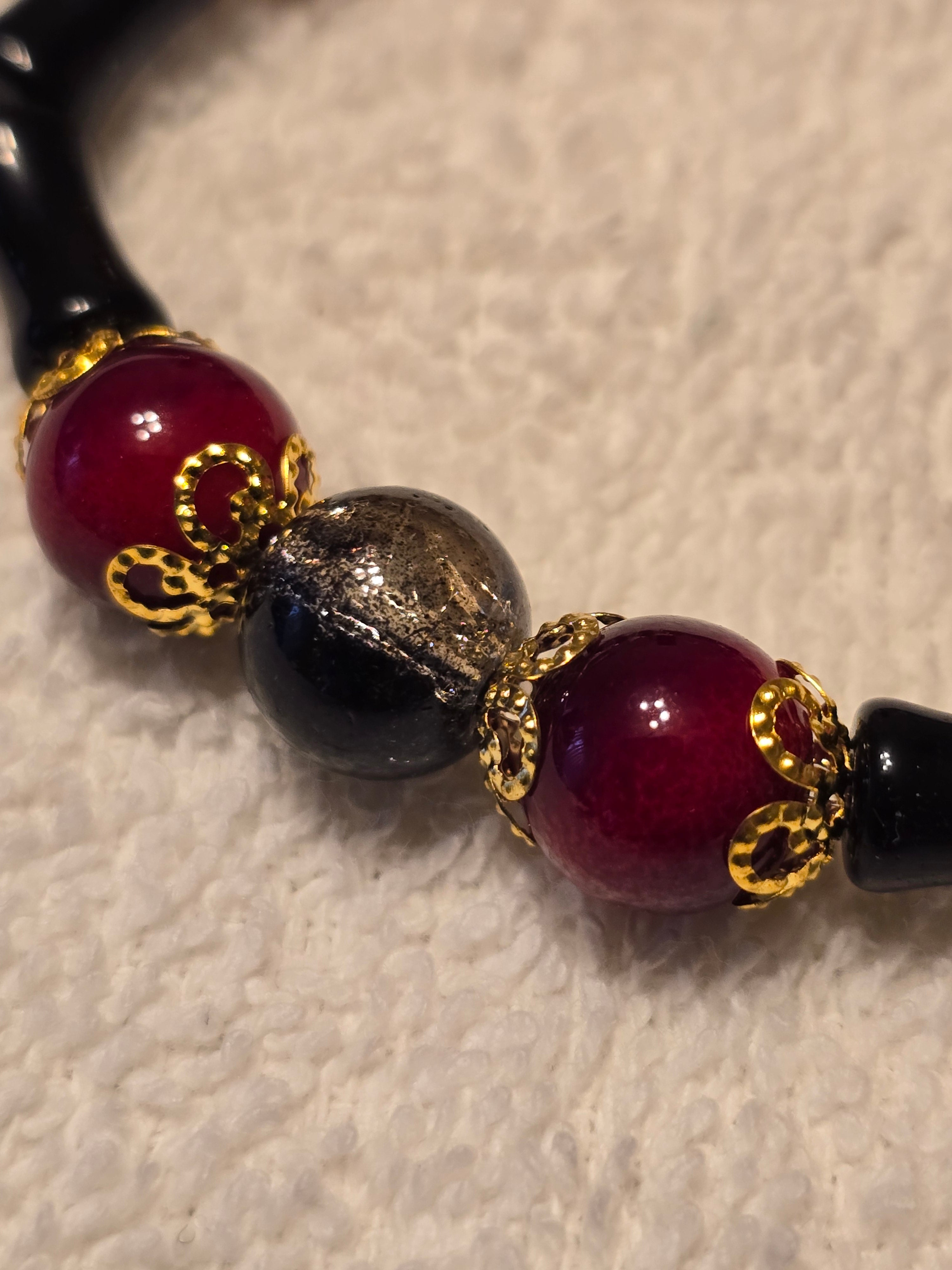Black and Red Glass Bead with Gold Accents